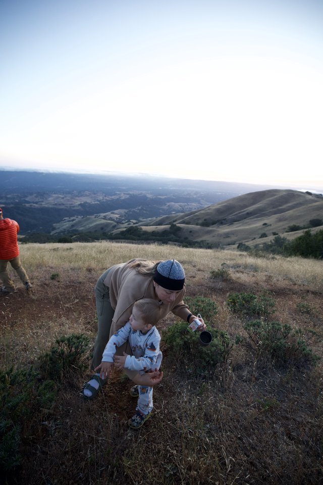 Mother and Toddler Explore Hilltop at Golden Hour