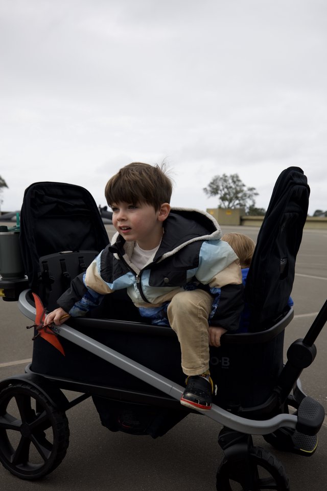 Young Boy in Adaptive Wheelchair at Outdoor Location