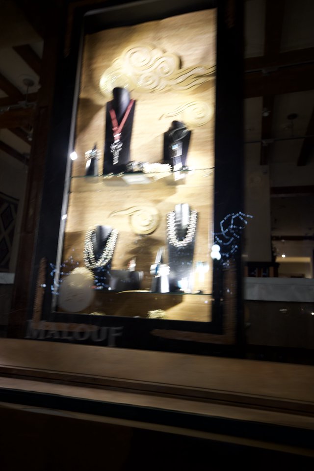 Illuminated Jewelry Display Case at Night
