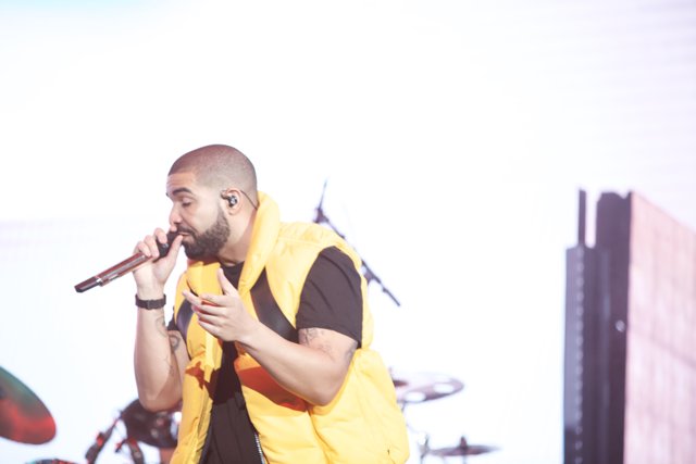 Drake Takes the Stage in a Vibrant Yellow Vest