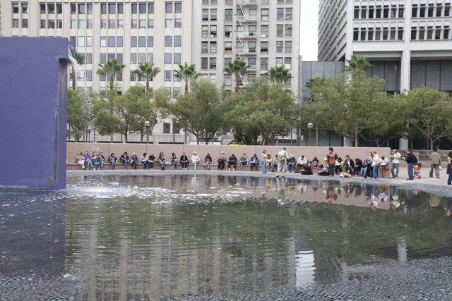 City dwellers gather around a beautiful fountain