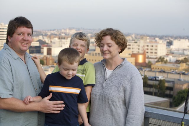 Family Portrait on Urban Rooftop at Dusk