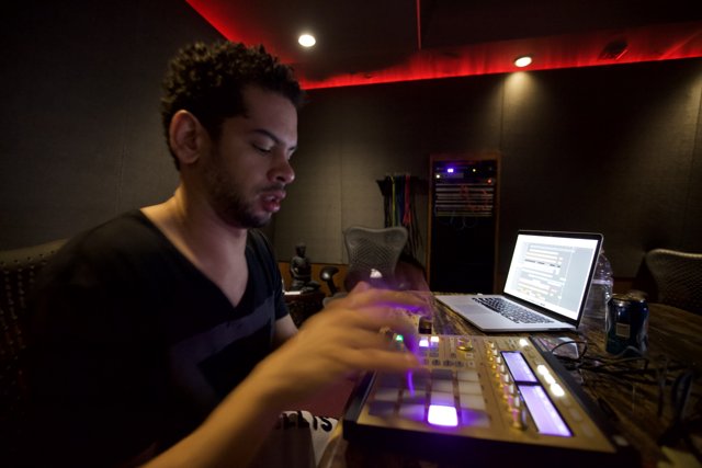 Marc Kinchen Working on a Laptop in the Recording Studio