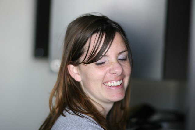 Candid Laughter: Woman Smiling with Eyes Closed