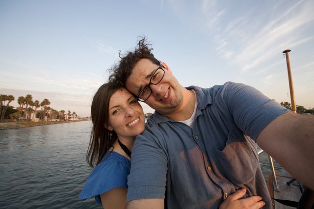 Couple's Joyful Selfie on a Summer Waterway