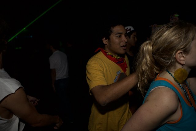 Nightclub Partygoers Enjoying the Beat as One Man Dances