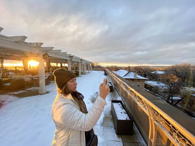 Capturing the Setting Sun over a Snowy Rooftop