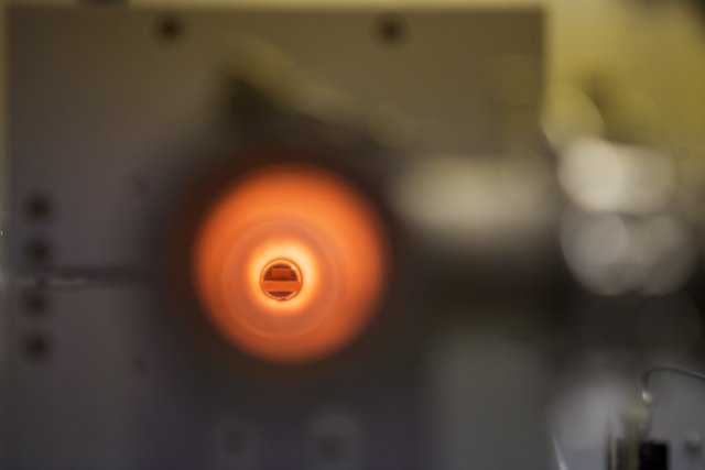 Glowing hole in metal sphere