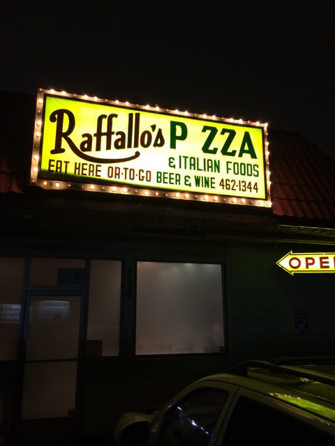Raffalo's Pizza Sign Shines Brightly in the Night Sky