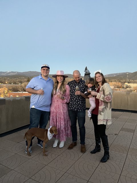 Family Photo with Furry Friend on Rooftop