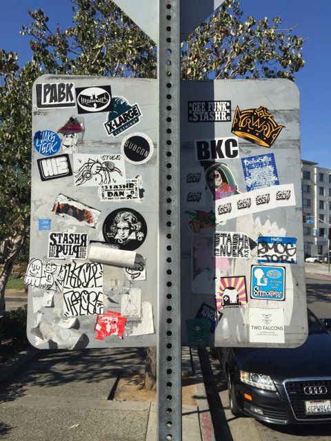 Stickers Galore on Los Angeles Street Sign