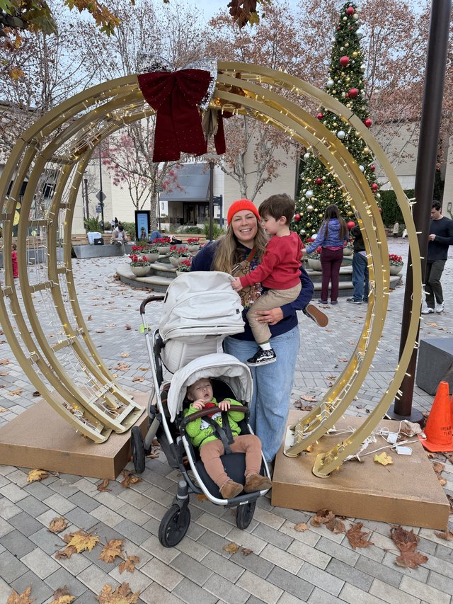 Family Holiday Photo at Festive Christmas Display