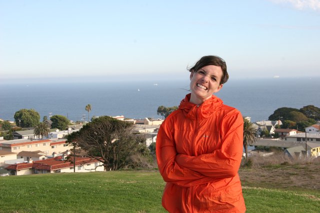 Smiling Woman Overlooking Coastal California Town