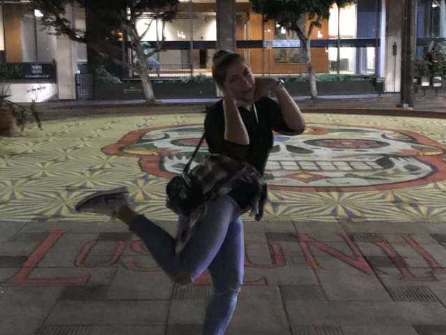 Jumping for Joy in front of Murals