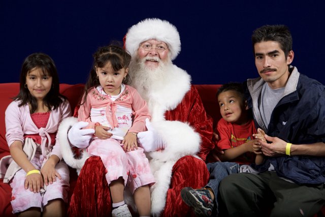 Santa Claus spreading holiday cheer with children
