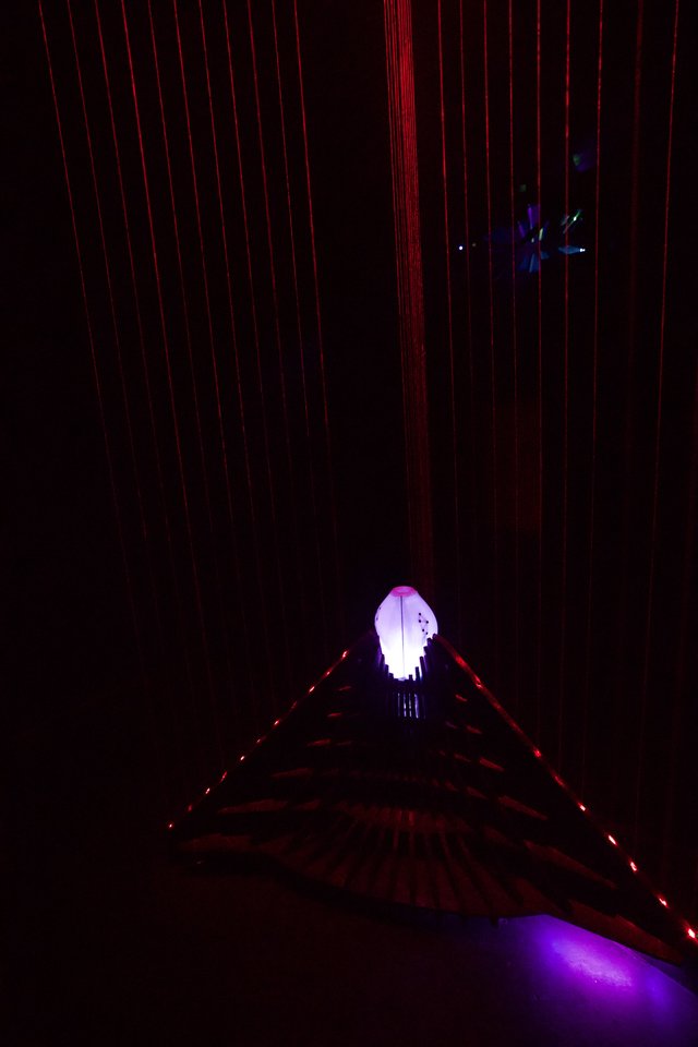 Illuminated Art Installation with Red Laser Grid