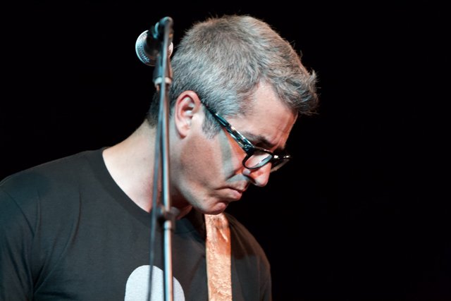 Brett Gurewitz Rocks the Stage with his Guitar and Glasses