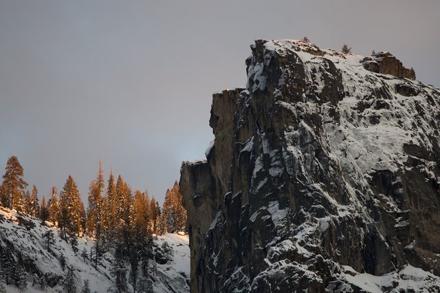 Snow-Dusted Rock Pinnacle at Winter Sunset