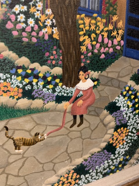 Woman and Cat in a Garden Walkway