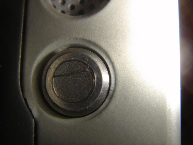 Shiny Silver Button on a High-Tech Cell Phone