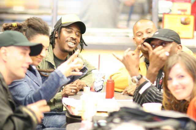 Friends Laughing Together at Fast Food Restaurant