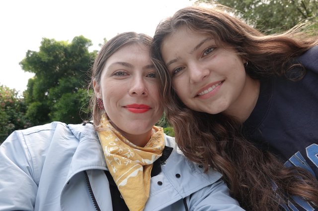 Two Friends Taking Sunny Outdoor Selfie