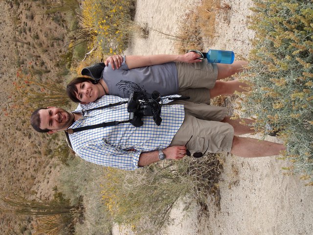 Couple Hiking Through Desert Wilderness Trail