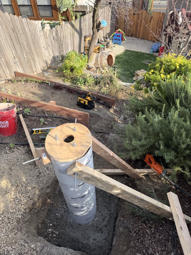 DIY Backyard Deck Foundation Construction in Progress