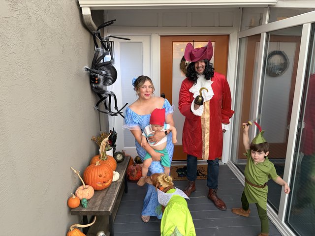 Family Peter Pan Halloween Costume Portrait on Front Porch