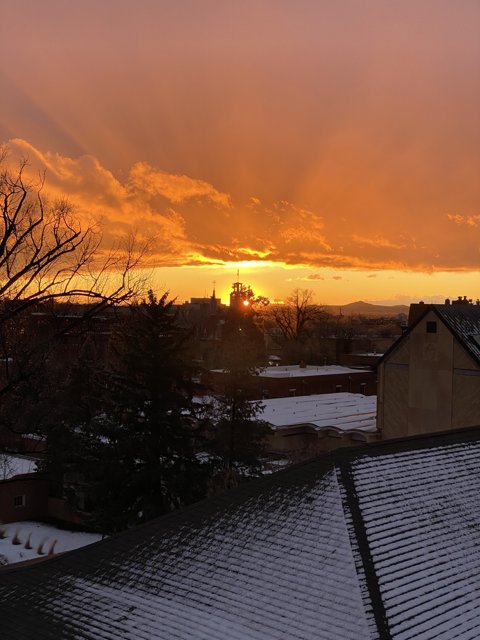 Snowy Rooftop Sunset
