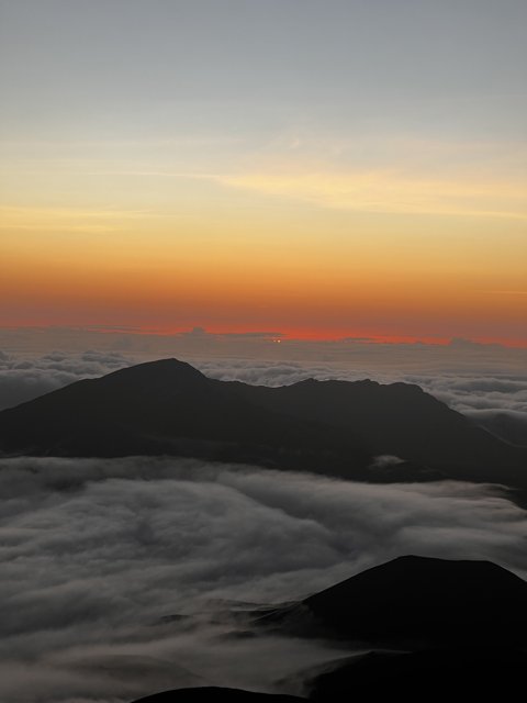 Summit Sunrise Above the Clouds