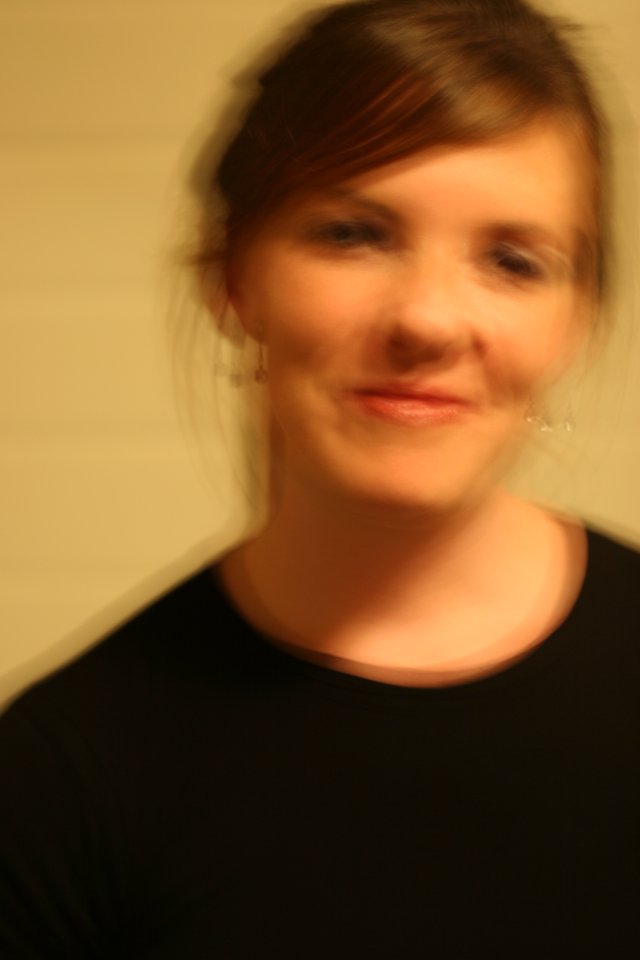 Soft Focus Portrait of Smiling Woman in Black