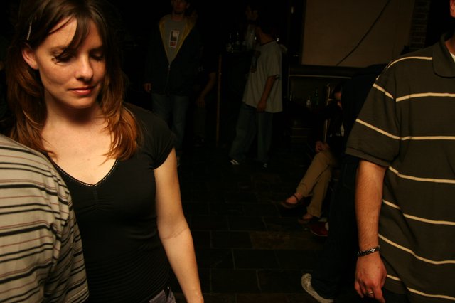 Young Woman at Dimly Lit Nightclub Event