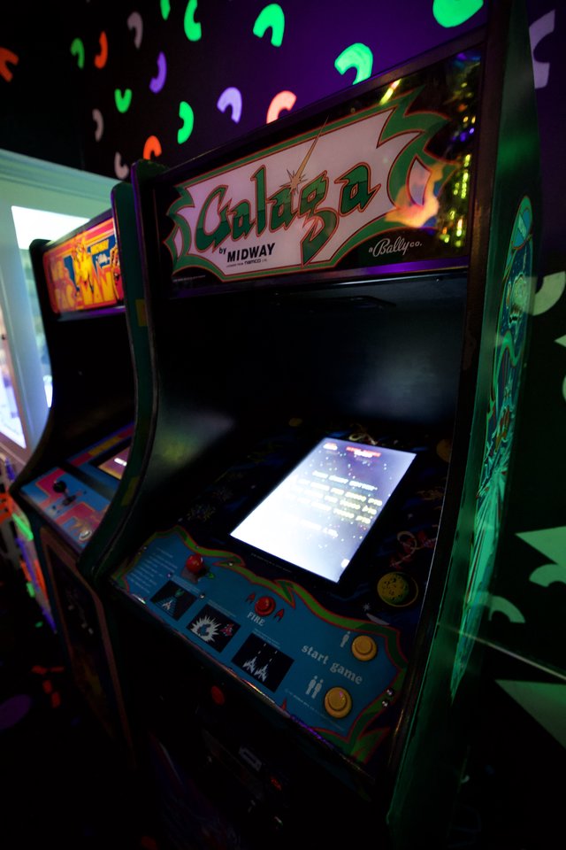 Classic Galaga Arcade Cabinet in Retro Gaming Venue