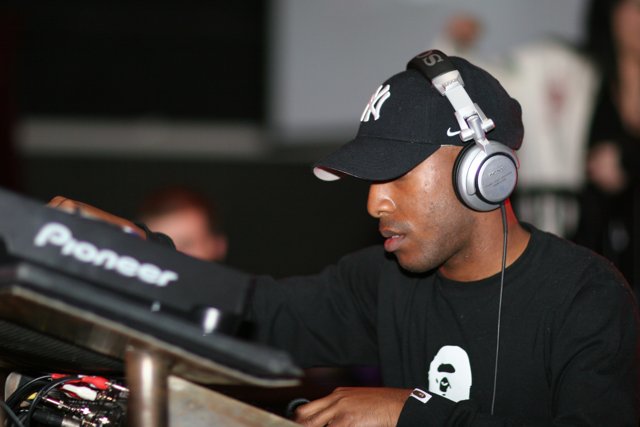 Headnodding DJ in Black Shirt