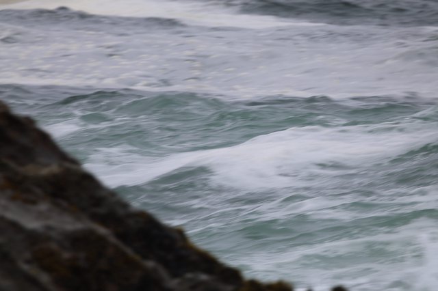 Churning Atlantic Waves Crash Against Rocky Coastline