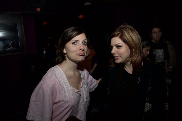 Two Women Sharing a Moment at Nightclub Event