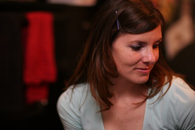 Thoughtful Woman in Soft Blue at Evening Event