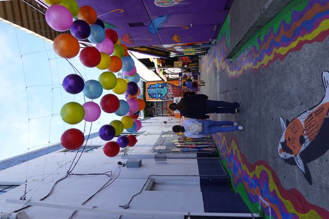 Vibrant Balloon-Decorated Street Art Alley