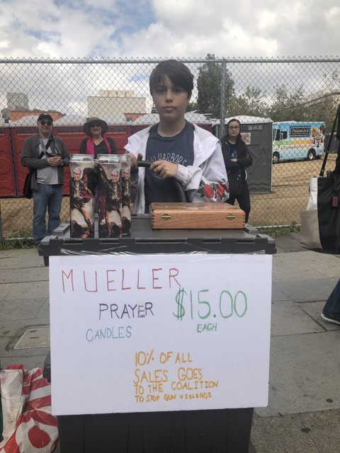 Young Boy Selling Candles on a Cloudy Day