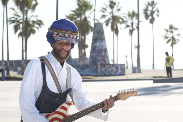 Musician in a Turban with a Guitar