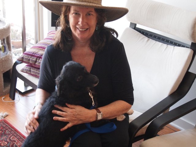 Woman with Hat and Black Dog