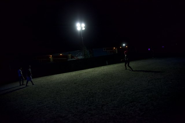 Nighttime Soccer Game Under the Lamp Post