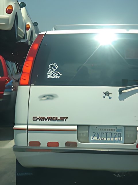 White Car with Back Sticker