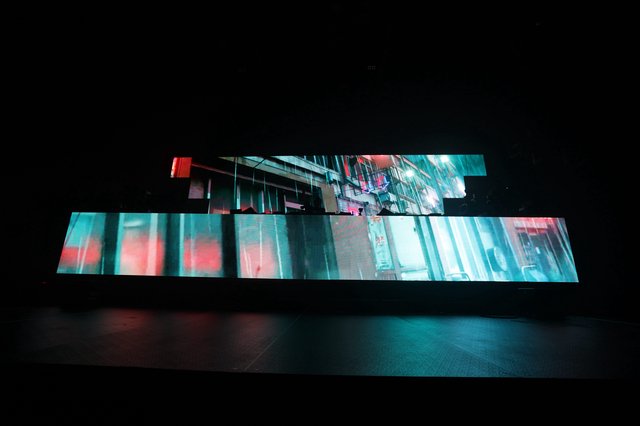 Cyberpunk Cityscape Projected Across Fragmented LED Panels