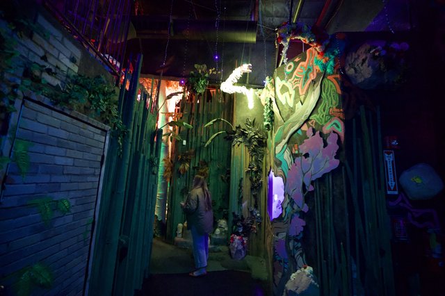 Immersive Art Installation with Neon and Nature Elements