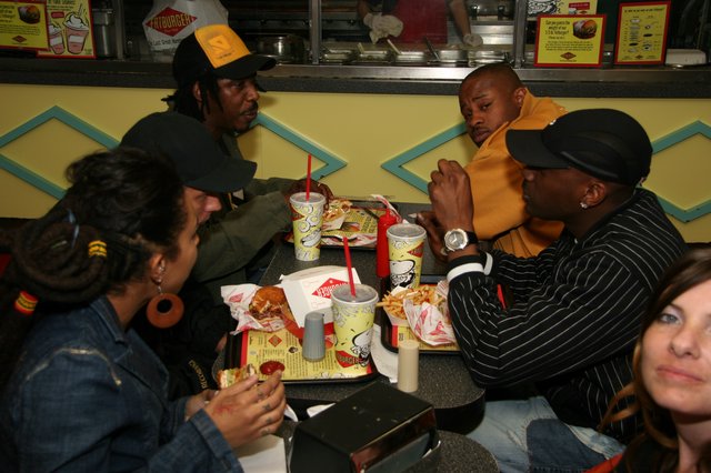 Friends Sharing a Meal at Fatburger Restaurant