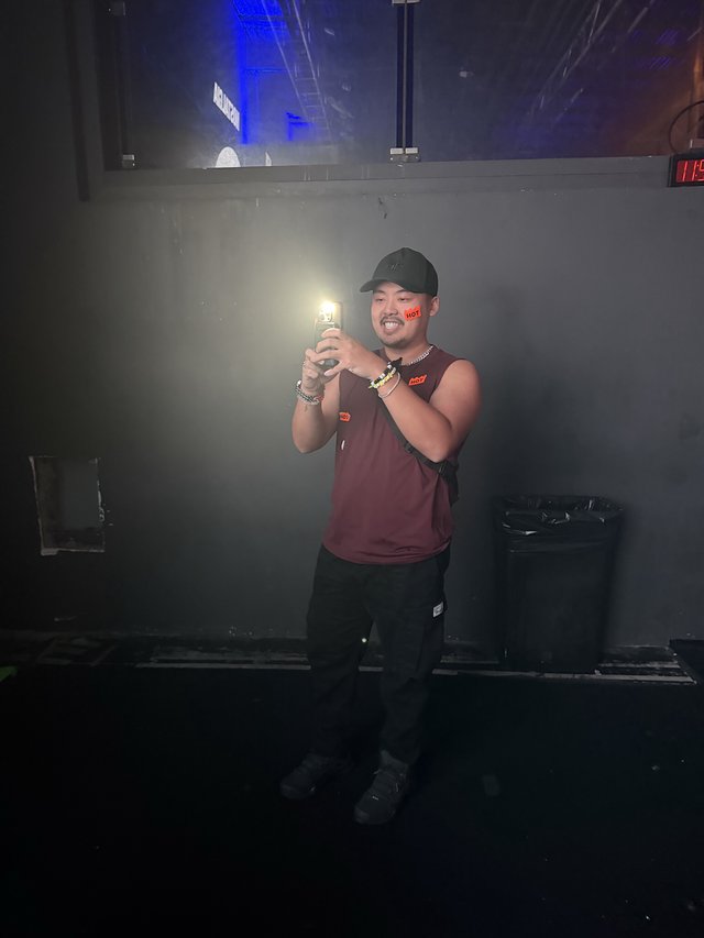 DJ Performer Captured Mid-Set at Electronic Music Venue