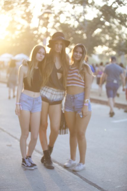 Three Smiling Girls on a Sunny Street