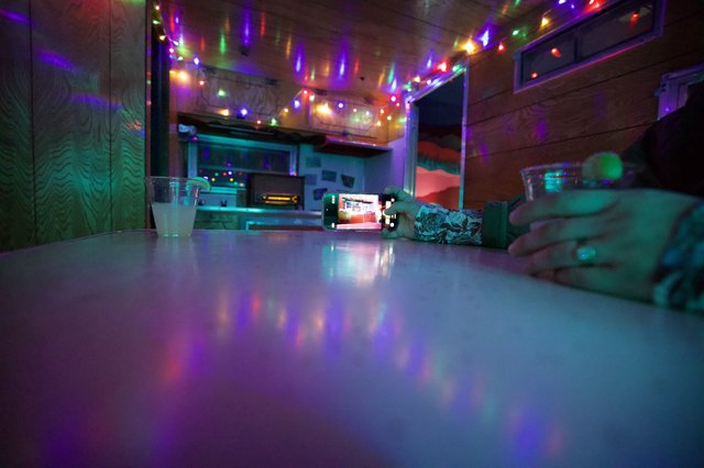 Intimate Evening at Colorful String-Lit Bar Counter
